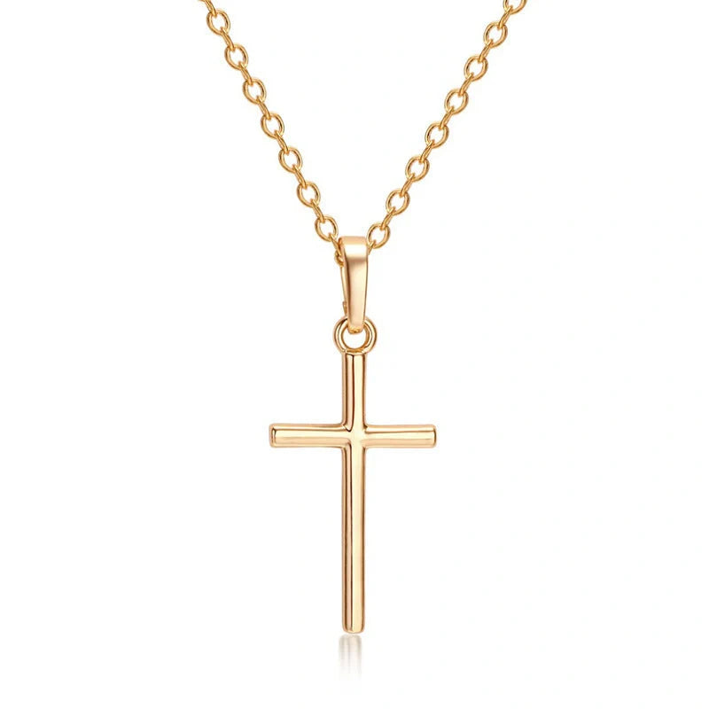 Elegant cross pendant necklace in gold and silver tones, a timeless British accessory