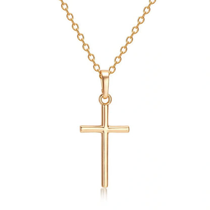 Elegant cross pendant necklace in gold and silver tones, a timeless British accessory