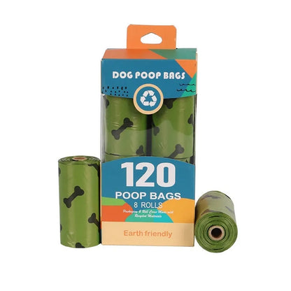 Roll of military green degradable dog poop bags with black bone print, shown next to a plastic dispenser.