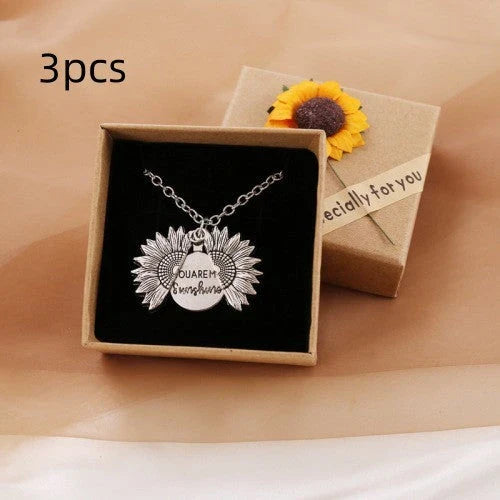 A stunning sunflower pendant necklace with an adjustable chain, crafted from high-quality materials for a radiant and versatile accessory.
