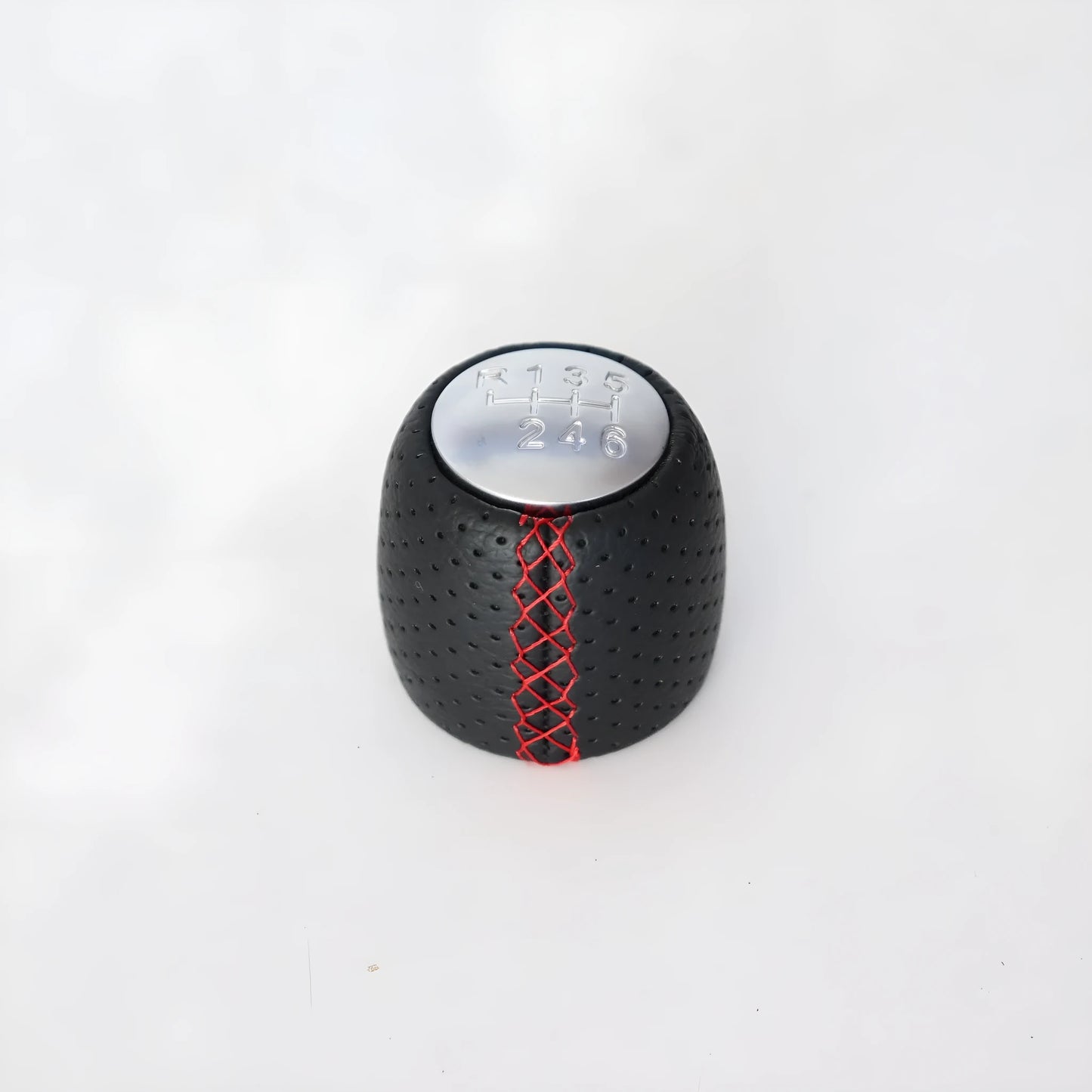 Sewn wrapped leather perforated style handball gear knob for Alpha vehicles in black, red, and white colour options.