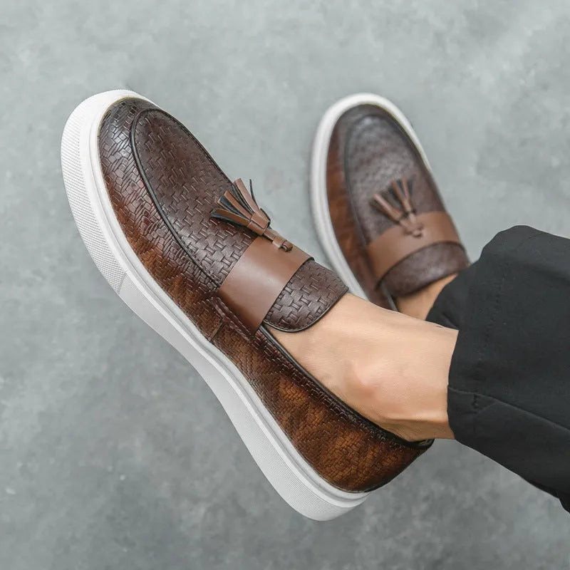 Men's black casual leather shoes with fringe detailing on round toe and low heel