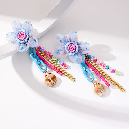 Handmade bohemian shell tassel earrings for women with colourful flower and geometric drop design
