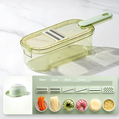 Shredded vegetable slicer with stainless steel blades on green cutting board