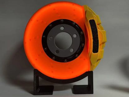 Brake disc design LED night light with caliper details in blue, red, or yellow colour options on desktop