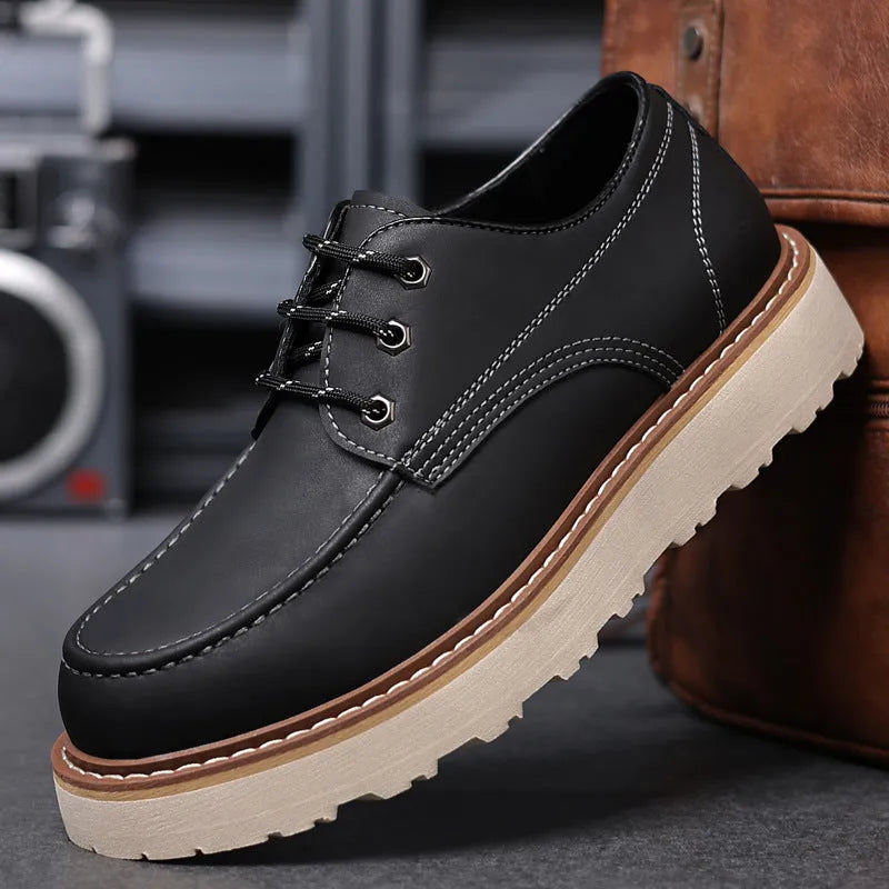 Men's black low-top Martin boot with round toe and non-slip rubber sole on a white background.