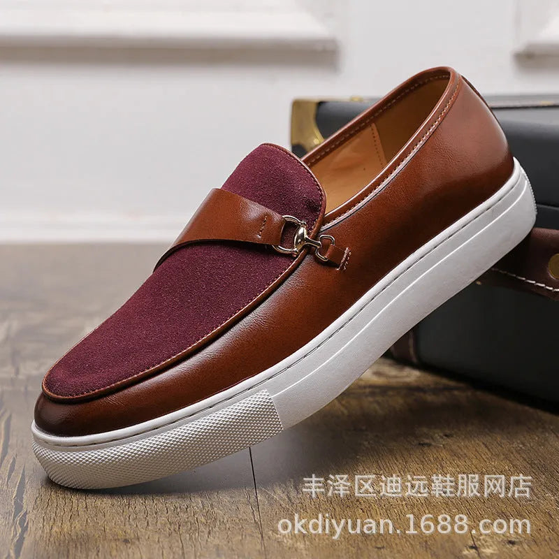 Men's black slip-on shoes with a gold horsebit buckle detail and round toe.