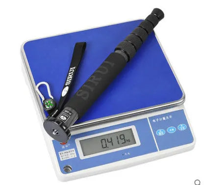 Black carbon fibre telescopic monopod for SLR cameras shown at full extension.