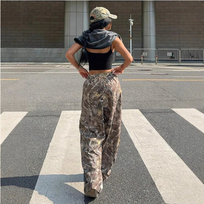 Stylish women's camouflage cargo pants with multiple pockets for a trendy look.
