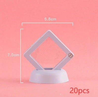 3D floating jewelry coin display stand in white and black, showcasing collectibles in mid-air