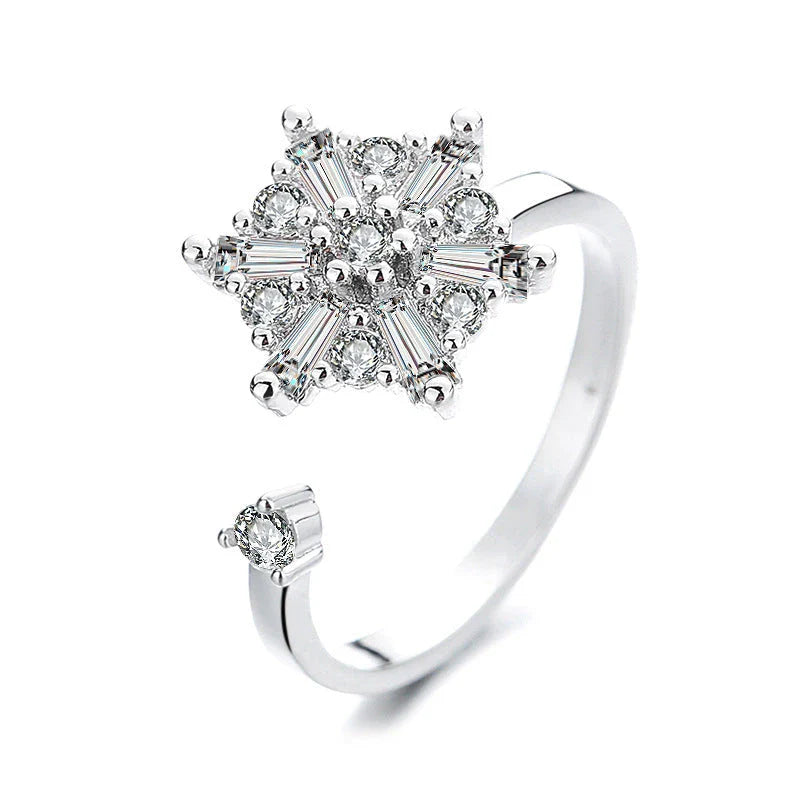 Adjustable spinner ring with rotating floral, geometric, and nature-inspired motifs for women's fashion and stress relief