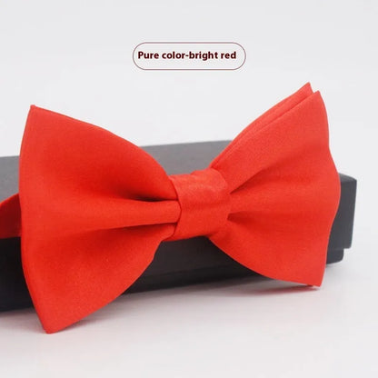 A solid colour pre-tied bow tie with an adjustable neck strap, shown in a classic flat head shape.