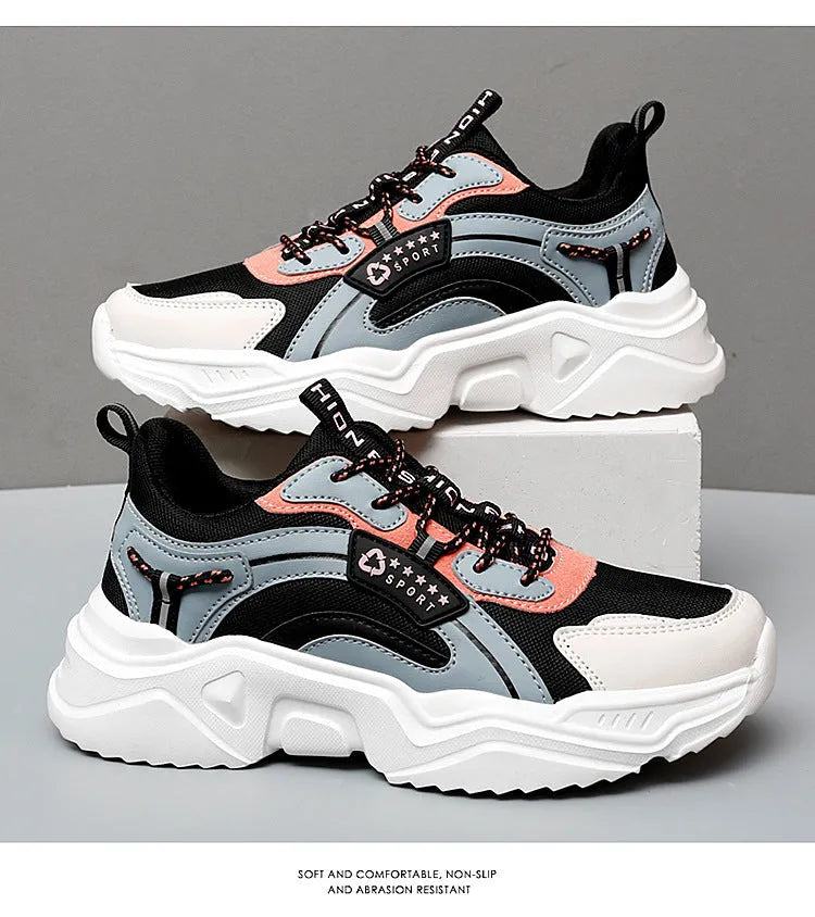 White women's thick-soled casual sports shoes with mesh upper, round toe, and buckle detail.