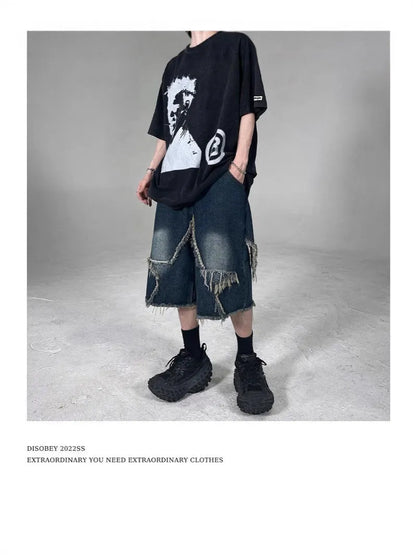Blue men's denim shorts with frayed hem, loose fit, and a white five-pointed star patch on the leg.