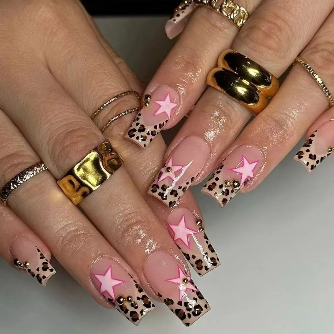 Leopard print French false nails with five-pointed star and pearl diamond accessories in retro European style