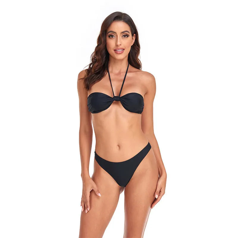Black polyester women's bikini set with lace-up tube top and briefs, showing adjustable ties and streamlined design