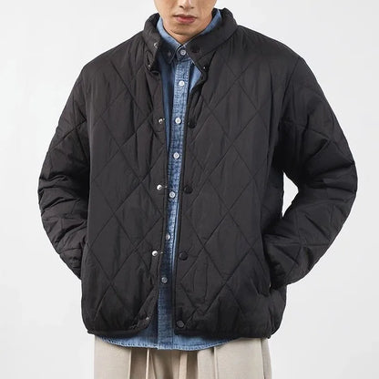 Men's black diamond lattice quilted winter jacket with a long 100cm length and loose fit.