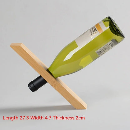 Natural bamboo wine bottle rack holding six bottles with wood grain visible