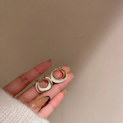 Stylish geometric earrings with dripping glaze in candy colours, perfect for adding a modern touch to any outfit.