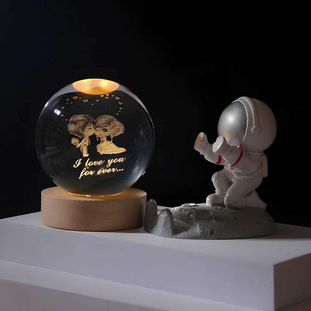 Cosmos Series crystal ball night light with wooden base and astronaut figure, showing Milky Way light pattern