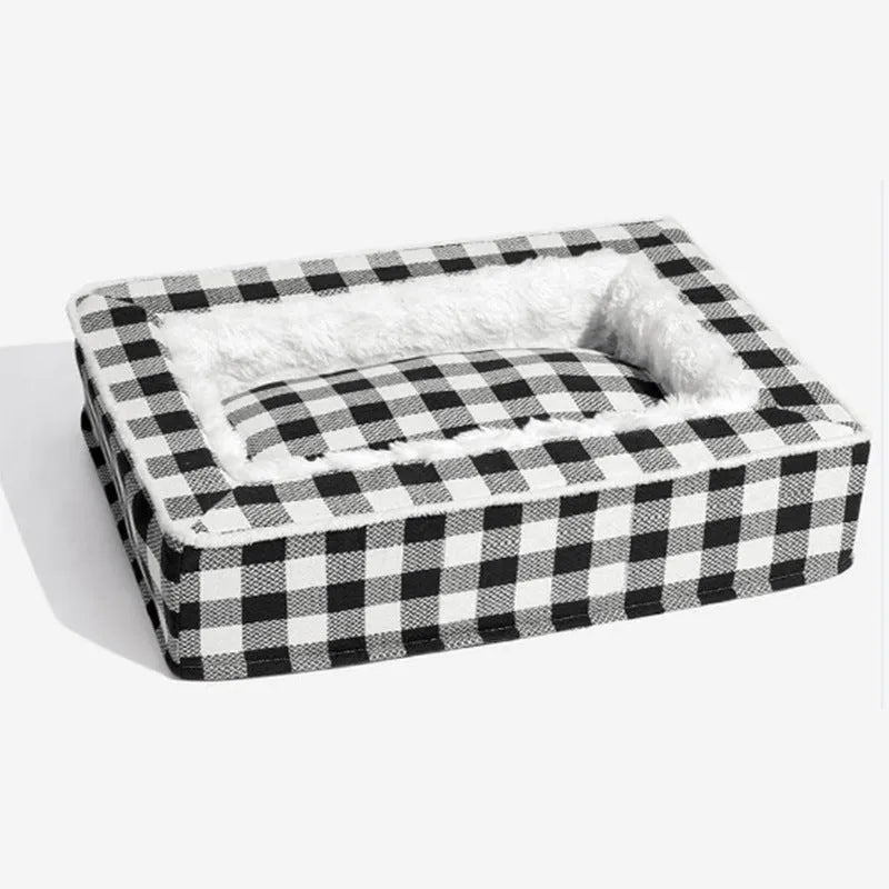 Classic red plaid dog bed cushion with a removable cover, shown in a large size next to a dog crate.