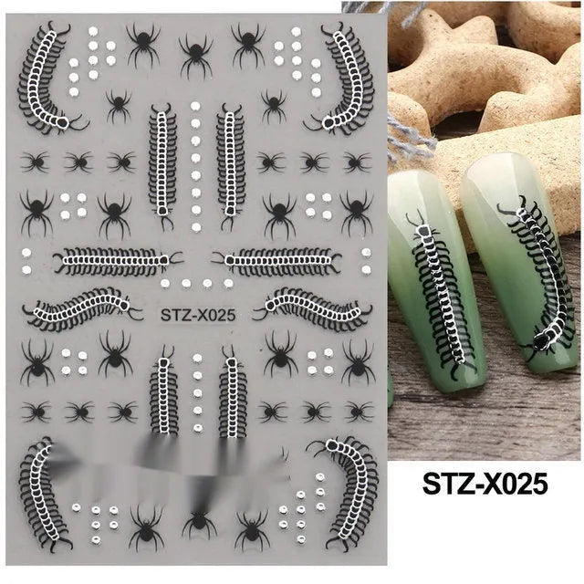 Assortment of black and silver nail sticker designs including cartoon and French tip patterns on a plastic sheet.