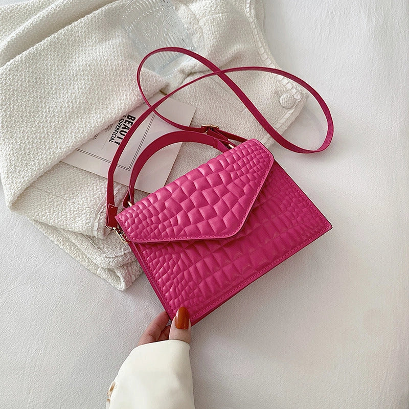 Clamshell handbag with crocodile pattern and soft handle in various colours