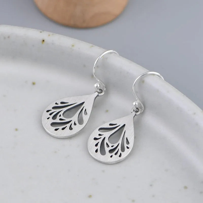 Women's retro craft hollow water drops small and exquisite earrings in 925 silver with drop shape ear drops colour design featuring grinding treatment process