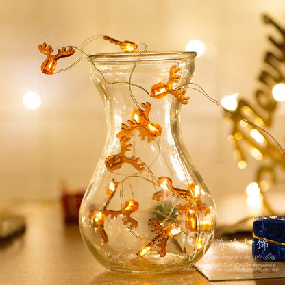 Copper wire LED Christmas decoration lights featuring festive designs like bells, trees, and elks