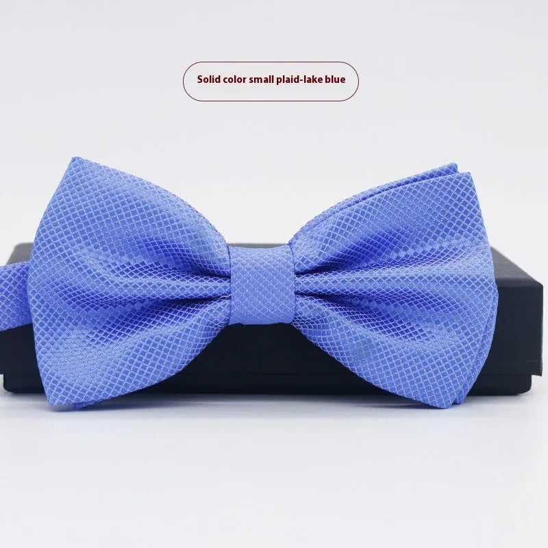 A solid colour pre-tied bow tie with an adjustable neck strap, shown in a classic flat head shape.