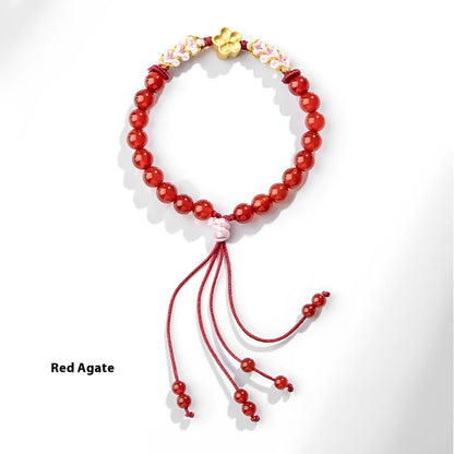 Hand-woven red rope bracelet with crystal peach blossom charm in Chinese style