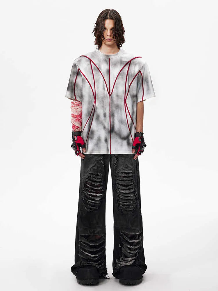 Padded shoulder short sleeve T-shirt with three-dimensional line patchwork detail on a mannequin.