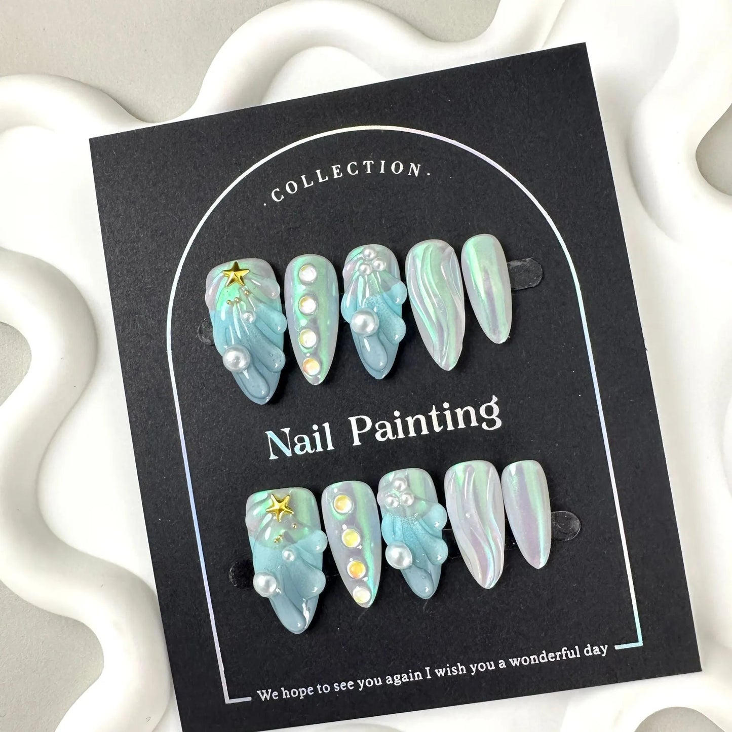 Blue shell design plastic nail tips in sizes XS, S, M, L from Hailang.