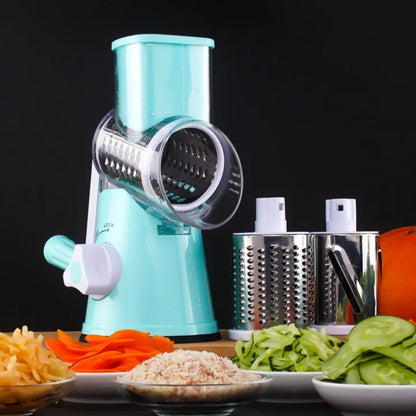Blue multifunctional round mandoline vegetable slicer and cheese grater with stainless steel blades on a kitchen counter.