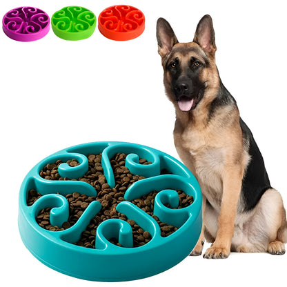 Coloured plastic dog slow feeder bowl showing internal maze pattern and ridges, with wide non-slip base