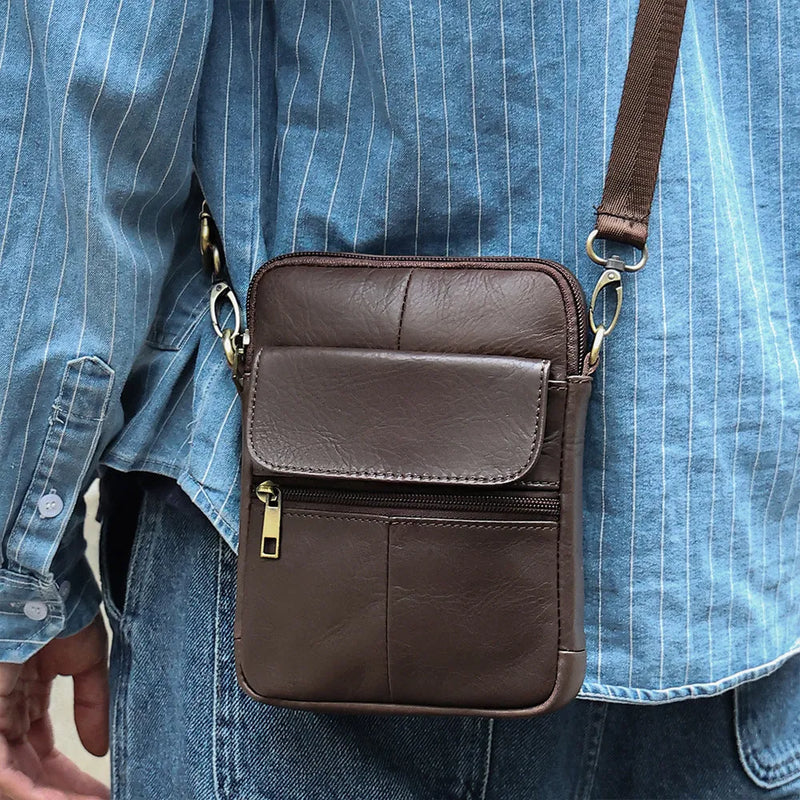 Men's crossbody shoulder bag crafted from genuine first-layer cowhide leather, featuring a solid-colour design with polyester cotton lining for wear-resistant leisure and travel use, available in 6710 Brown, 6710 Black, and 6710 Coffee