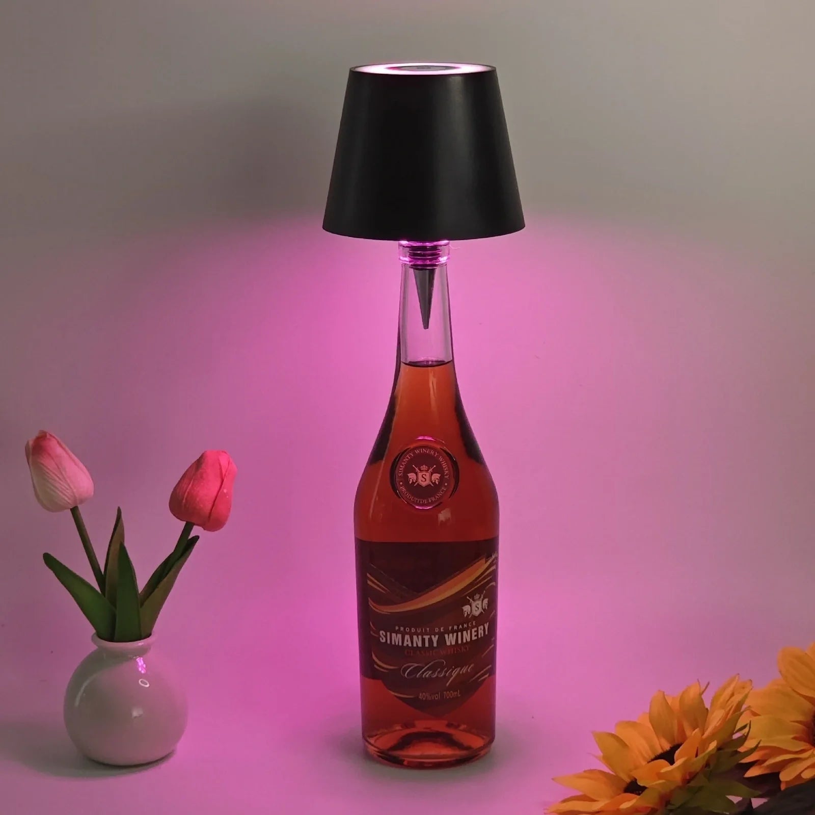 Wireless LED desk lamp in black tricolour finish, bottle-shaped with detachable base and touch control for 2000mAh powered lighting