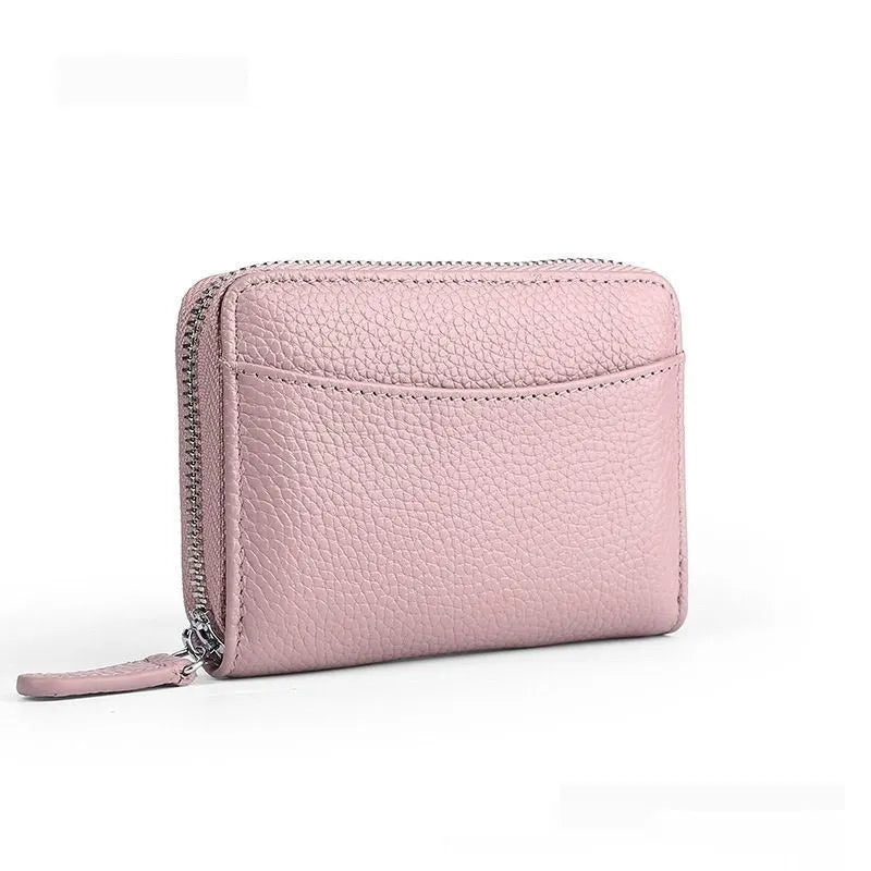 Genuine leather zipper coin purse in a solid colour showing sewing line detail.
