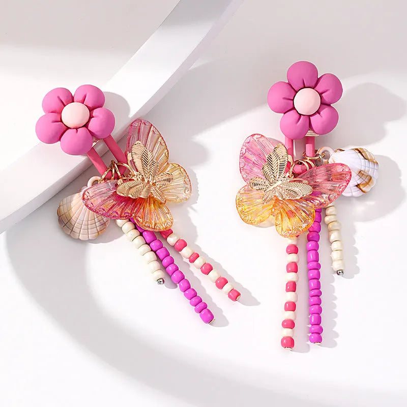Handmade bohemian shell tassel earrings for women with colourful flower and geometric drop design