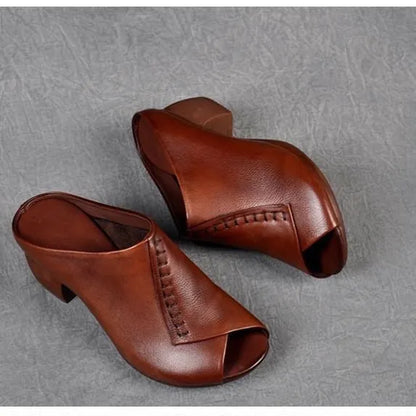 Women's black square heel peep-toe slippers with a rubber sole and fish mouth scaffold design.