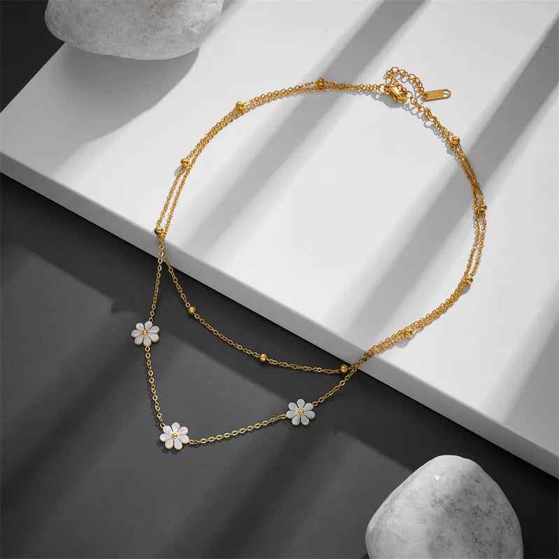 Stainless steel daisy flower jewellery set with necklace, bracelet, and earrings