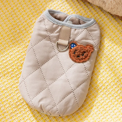 Quilted pet vest for small dogs with bear patch and polka-dot ears, padded dog gilet in cream or beige, sizes XS to XL.