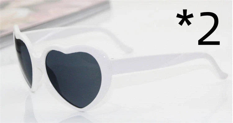 Fashionable heart-shaped light-up glasses with a built-in LED lighting system, perfect for adding a touch of love and playfulness to any occasion.