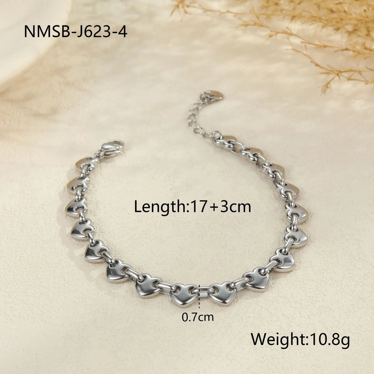 Women's hollow heart bracelet in stainless steel with 18K gold plating showing geometric design