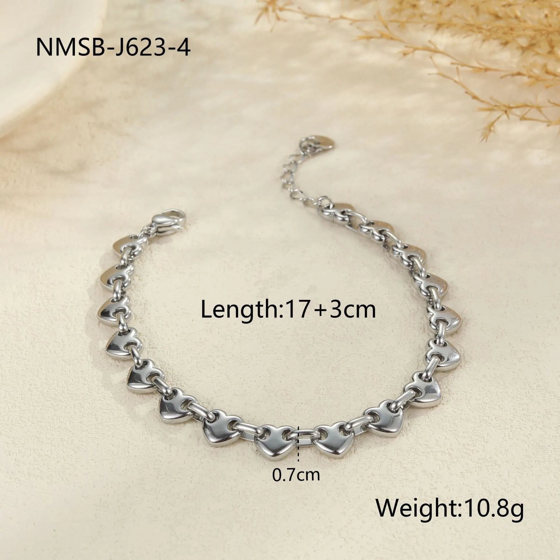 Women's hollow heart bracelet in stainless steel with 18K gold plating showing geometric design