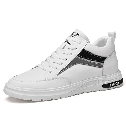 Men's white and black low-top casual sneakers with round toe and lace-up front, showcasing sewing line detail.