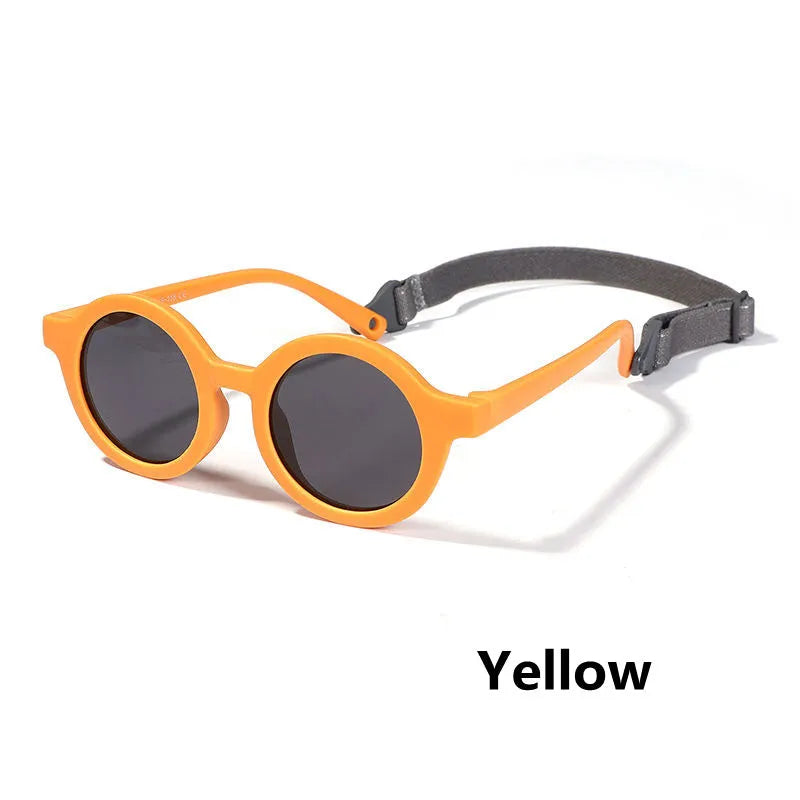 Children's round-frame polarised sunglasses with soft TPEE frame for ages 0-3, shown in assorted colours.