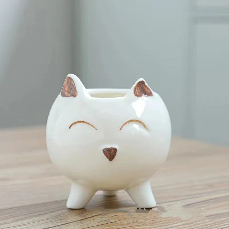 Ceramic succulent flowerpot with hand-painted cartoon animal and floral design in rustic style