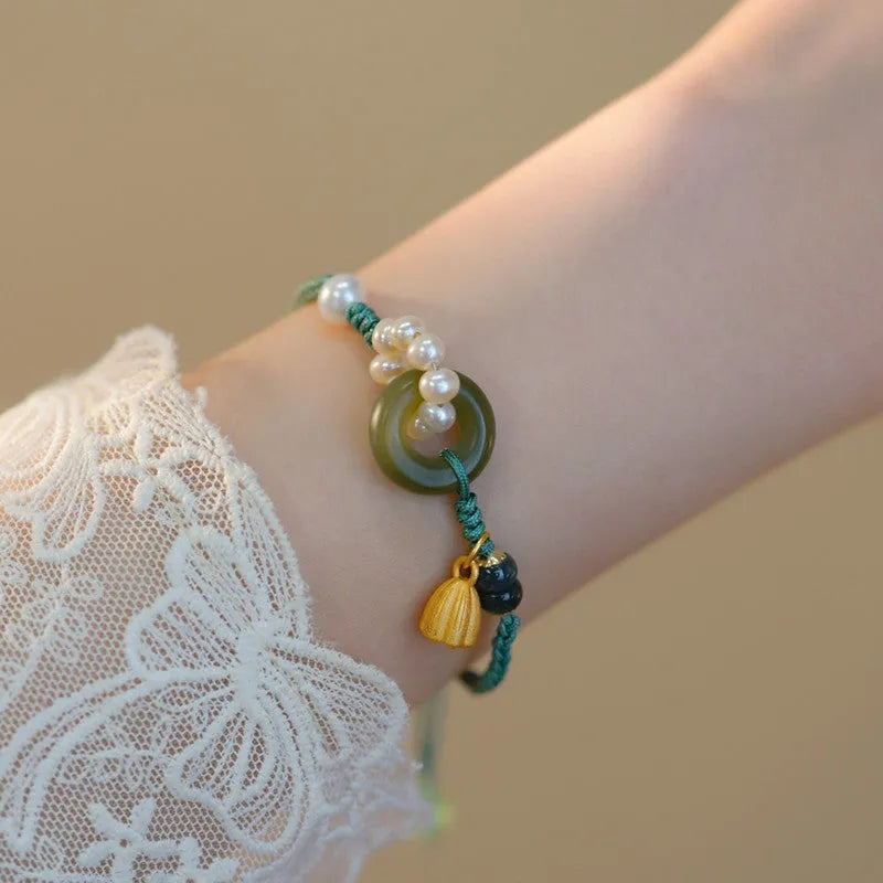 DIY woven watch band crafted from flexible wire and hand-woven with a Pearl Peace Buckle, presenting a retro style bracelet for women featuring a pearl as its central decorative element, suitable for creating customisable and elegant watch straps.