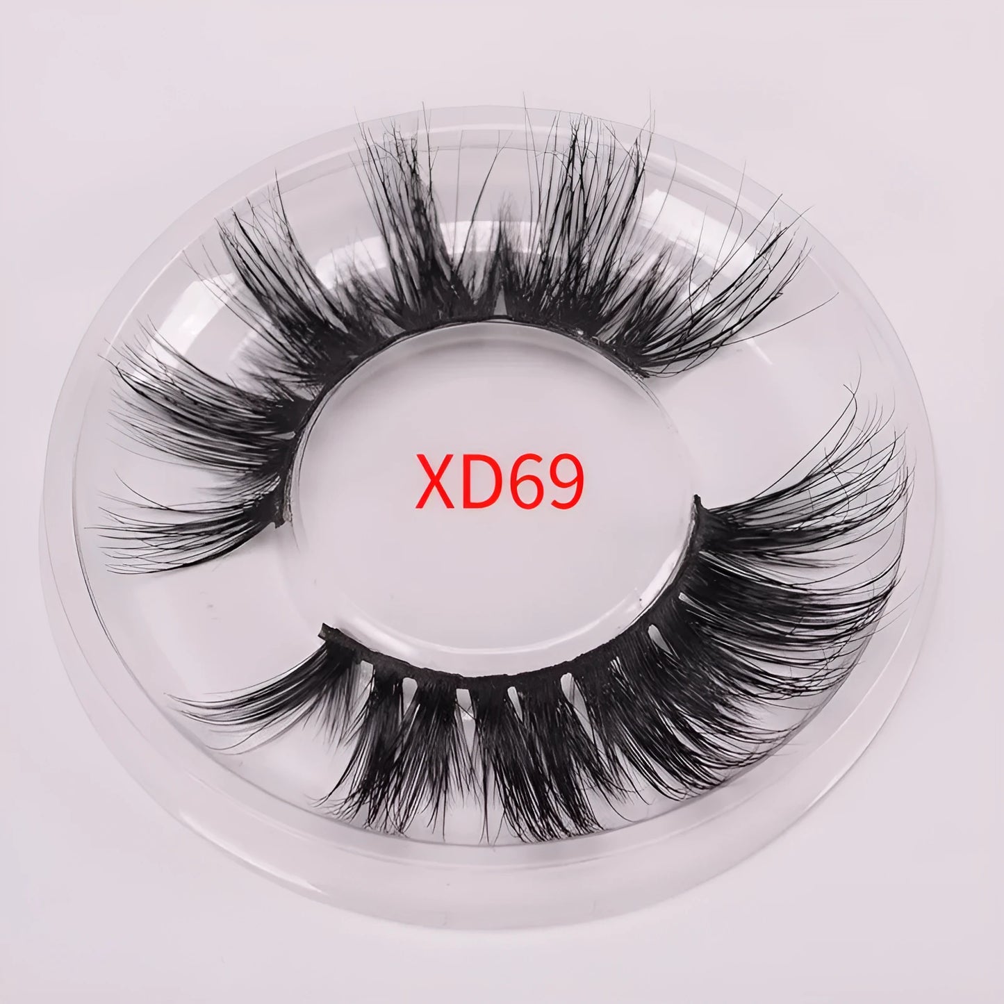 Affectionate brand 5D mink false eyelashes with a hair cap and double-headed brush on a pink background.